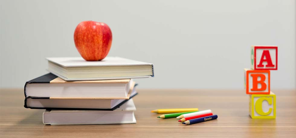 Books and apple