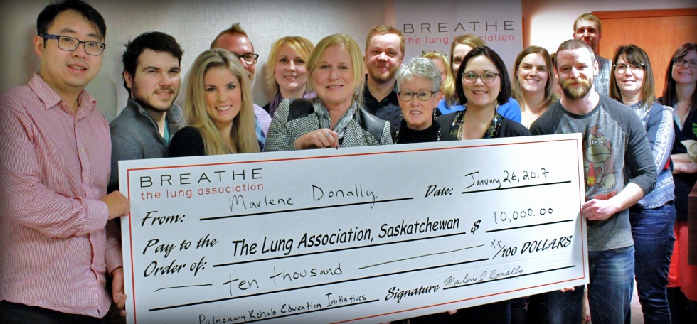 Marlene Donally presents a $10,000 cheque to the Lung Association.