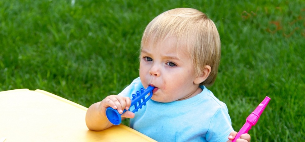 Child blowing horn