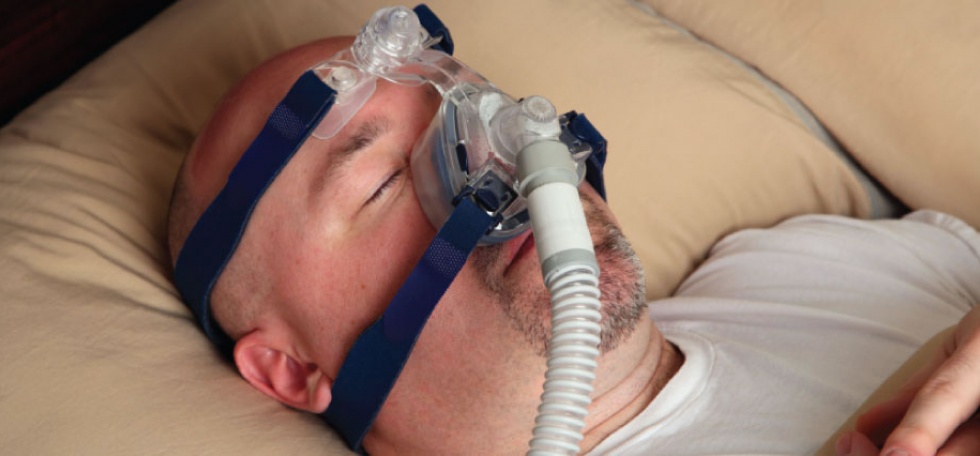 man with CPAP machine