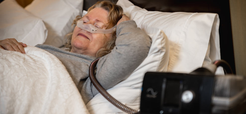 woman wearing a cpap in bed